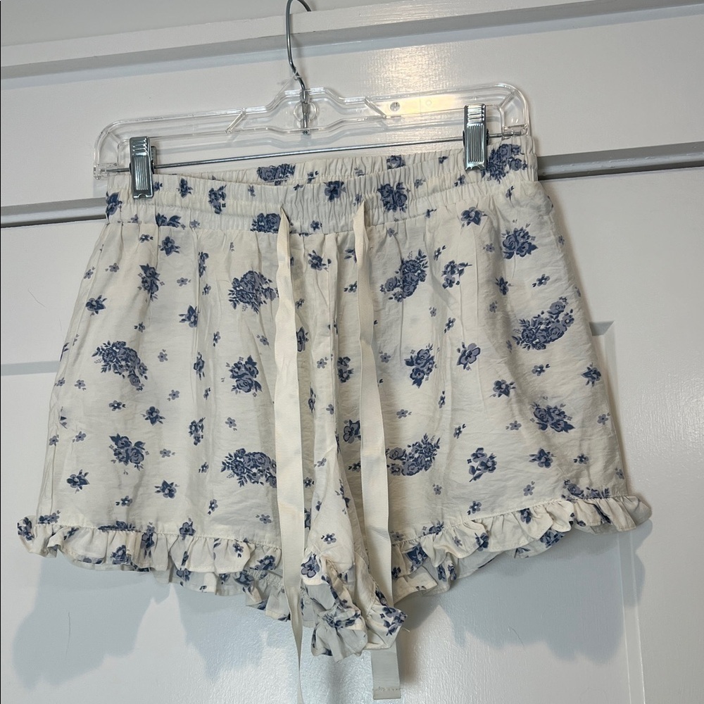 Threads of Luxx Blue Floral Women's Shorts with ruffled edge size medium.